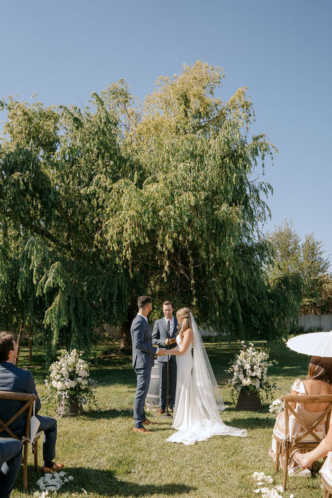 Lauren and Sebastian getting married under the weeping willow