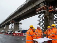 Engineers in hi-vis assessing a UK motorway viaduct during structural renewal works