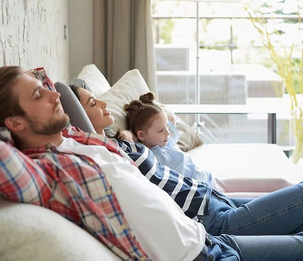 Two people enjoying air conditioning in their home,