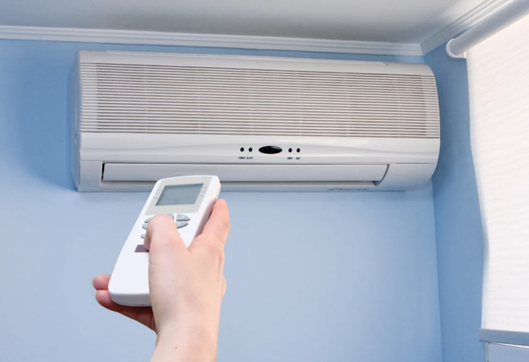 Mini Split unit being turned on.