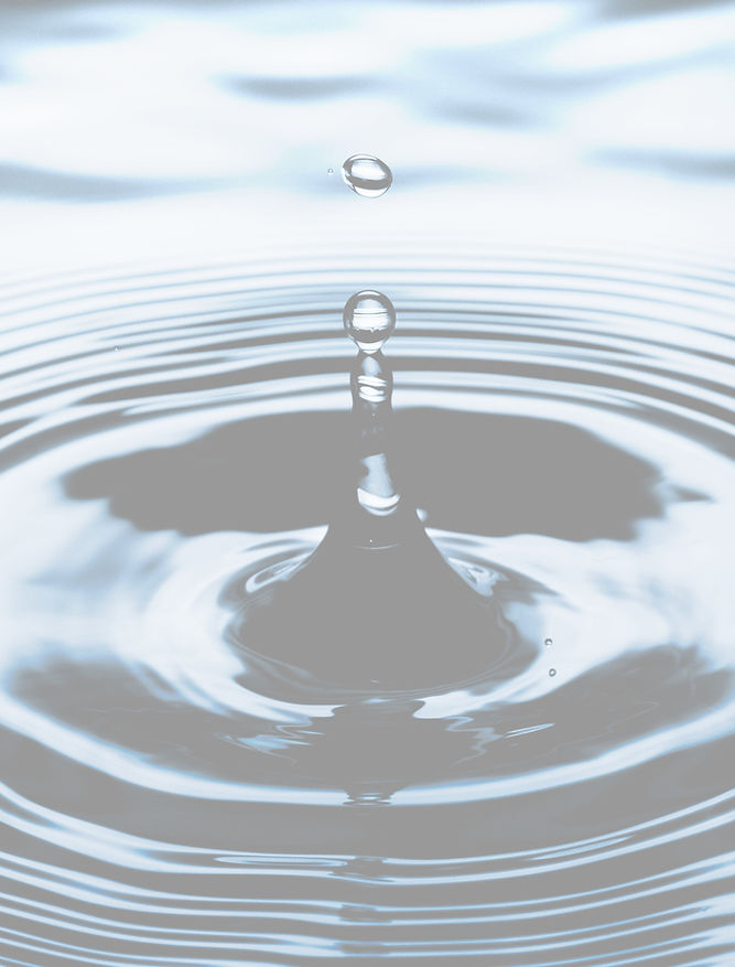 Faded blue color value of Water droplet splashing up shallow tank
