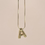 Thumbnail: Gold bubble letter necklace