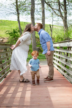 Mom and dad with child and maternity photos