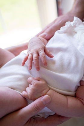 Newborn photo session holding baby