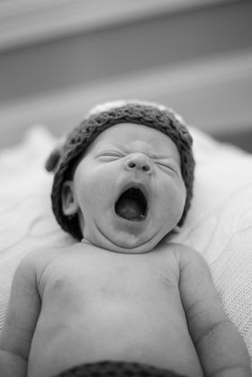 Newborn yawning black and white