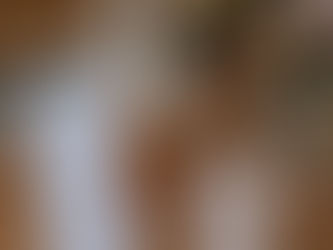 Flat lay of disco wedding details featuring elegant stationery suite, rings, disco balls, wildflower bridal bouquet perfume, and delicate styling elements arranged on a wood backdrop in natural light at the Evergreen Gardens