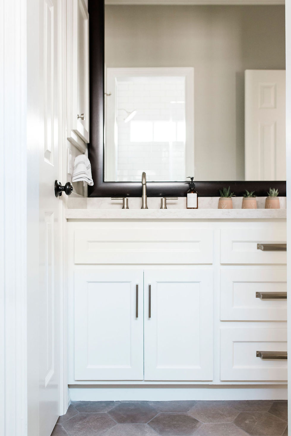 Updated transitional bathroom by Houston interior design firm Nancy Lane Interiors.