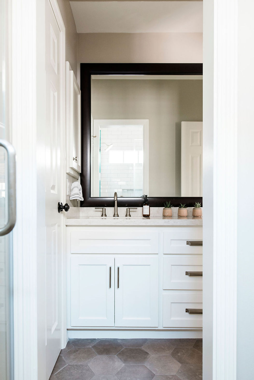 Updated transitional bathroom by Houston interior design firm Nancy Lane Interiors.