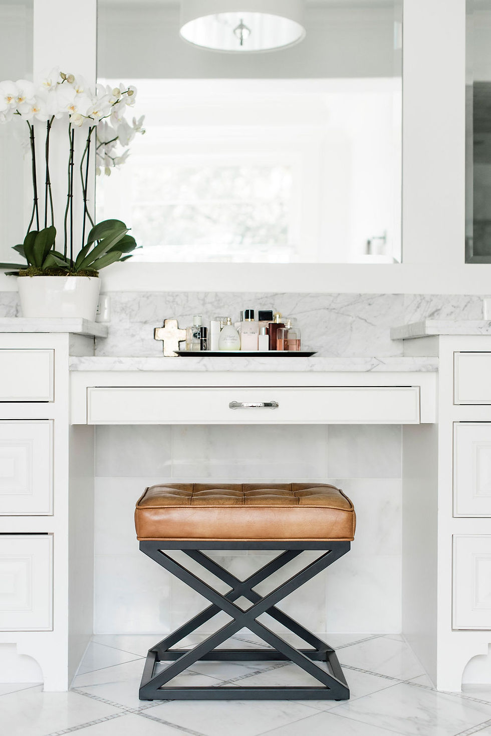 Modern transitional primary bathroom styled by Houston interior design firm Nancy Lane Interiors.
