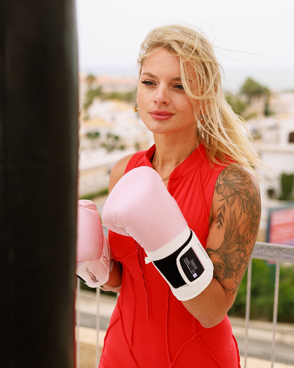 Woman with boxing gloves where legends train.