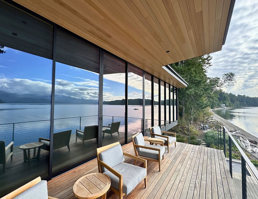Exterior view of buried block frame window detail, floor-to-ceiling glazing on waterfront home