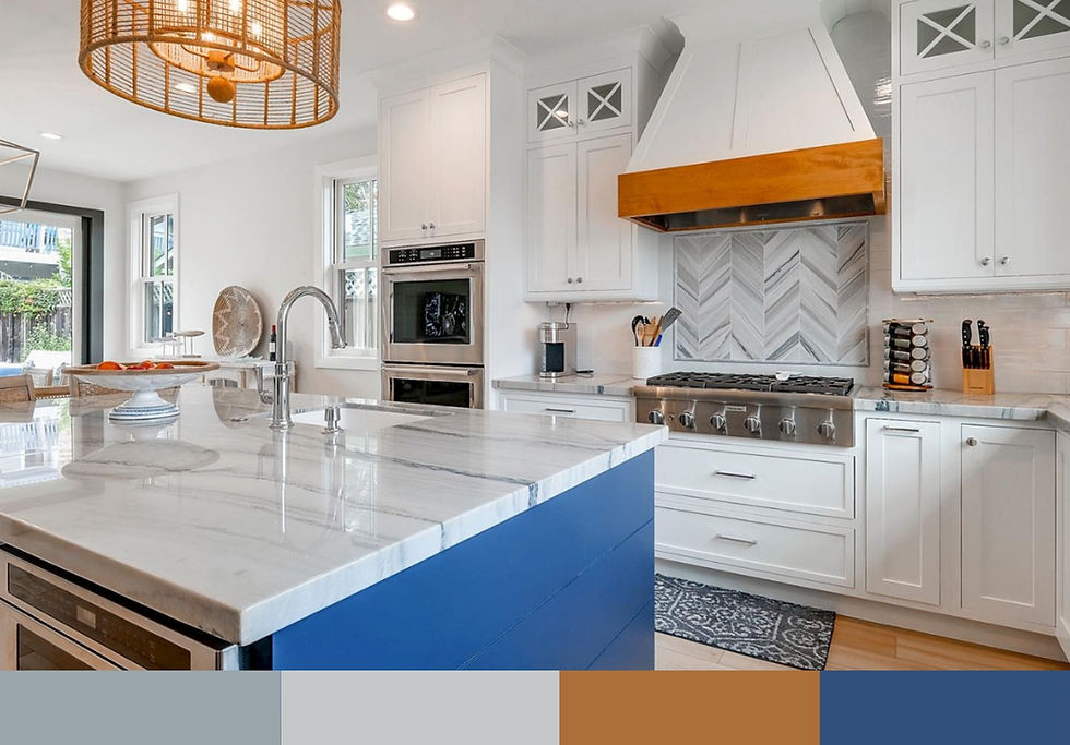 Ocean & Fog palette kitchen featuring deep blue island, white cabinetry, and rattan pendant lighting in Capitola coastal home