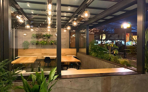 Wood-clad Stile system creating seamless interior-exterior connection in cafe environment