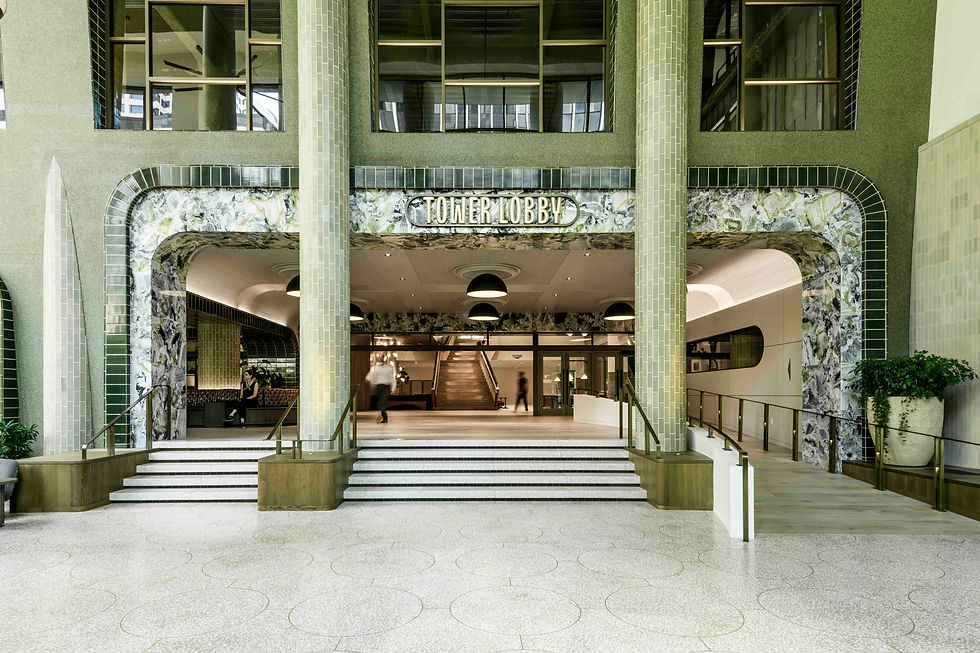 Tower Lobby entrance at Cedar Hall with central staircase, integrated ramp, terrazzo floor, and green tile archways.