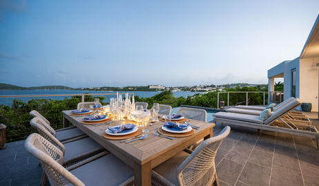 Outdoor dining in a St. Thomas vacation villa with an ocean view