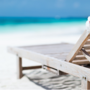 A Santa hat on a lounge chair