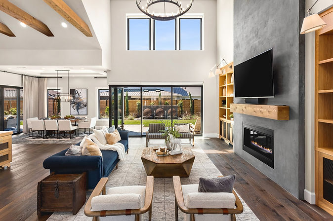 Modern farmhouse living room in the ‘Bespoke’ model at Street of Dreams, designed by Greylyn Wayne and staged with furniture from What’s New? Furniture.