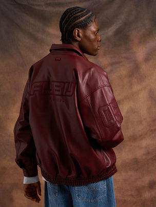 Fashion editorial for FUBU by Chroma Code, showcasing streetwear styling and bold urban visuals in a contemporary setting.