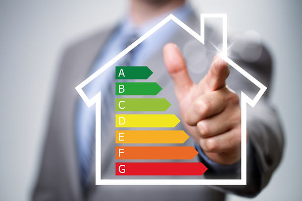 Businessman pointing to energy efficiency rating chart and house icon concept for performa