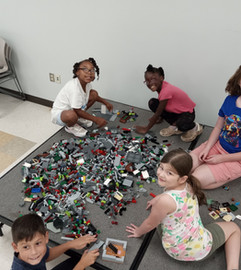 Children playing with LEGOs at Walthall County Library
