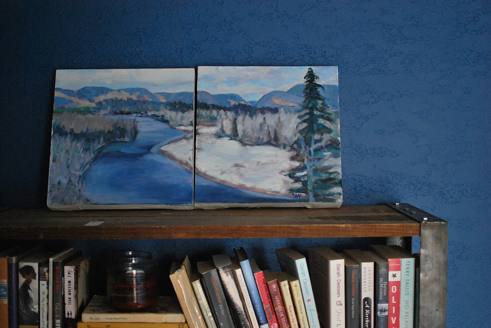 My mother's painting against the freshly painted blue wall, on the bookcase my boyfriend built for me