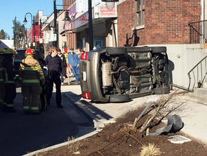 The Record - Vehicle crashes, flips on its side in downtown Mission