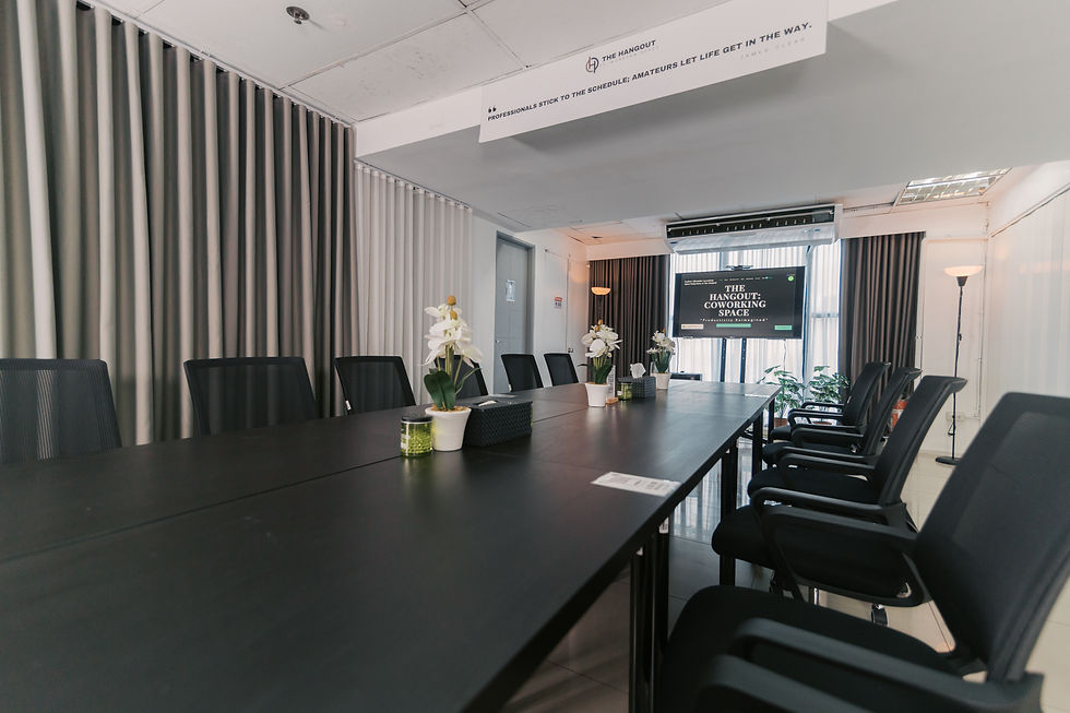 Wide angle view of modern coworking space with desks and ambient lighting