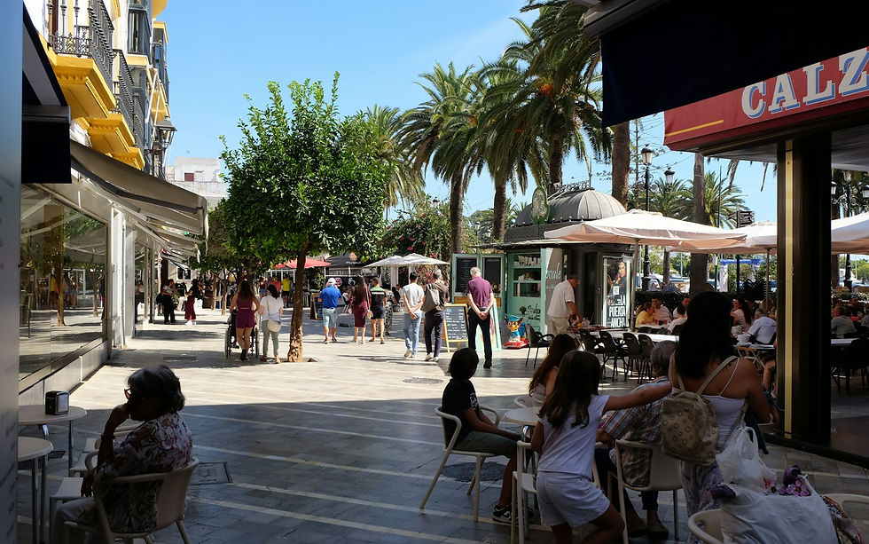People enjoying a sunny day at an outdoor cafe