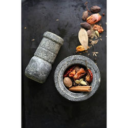 ​Indian Spices in a traditional stone pestle and mortar