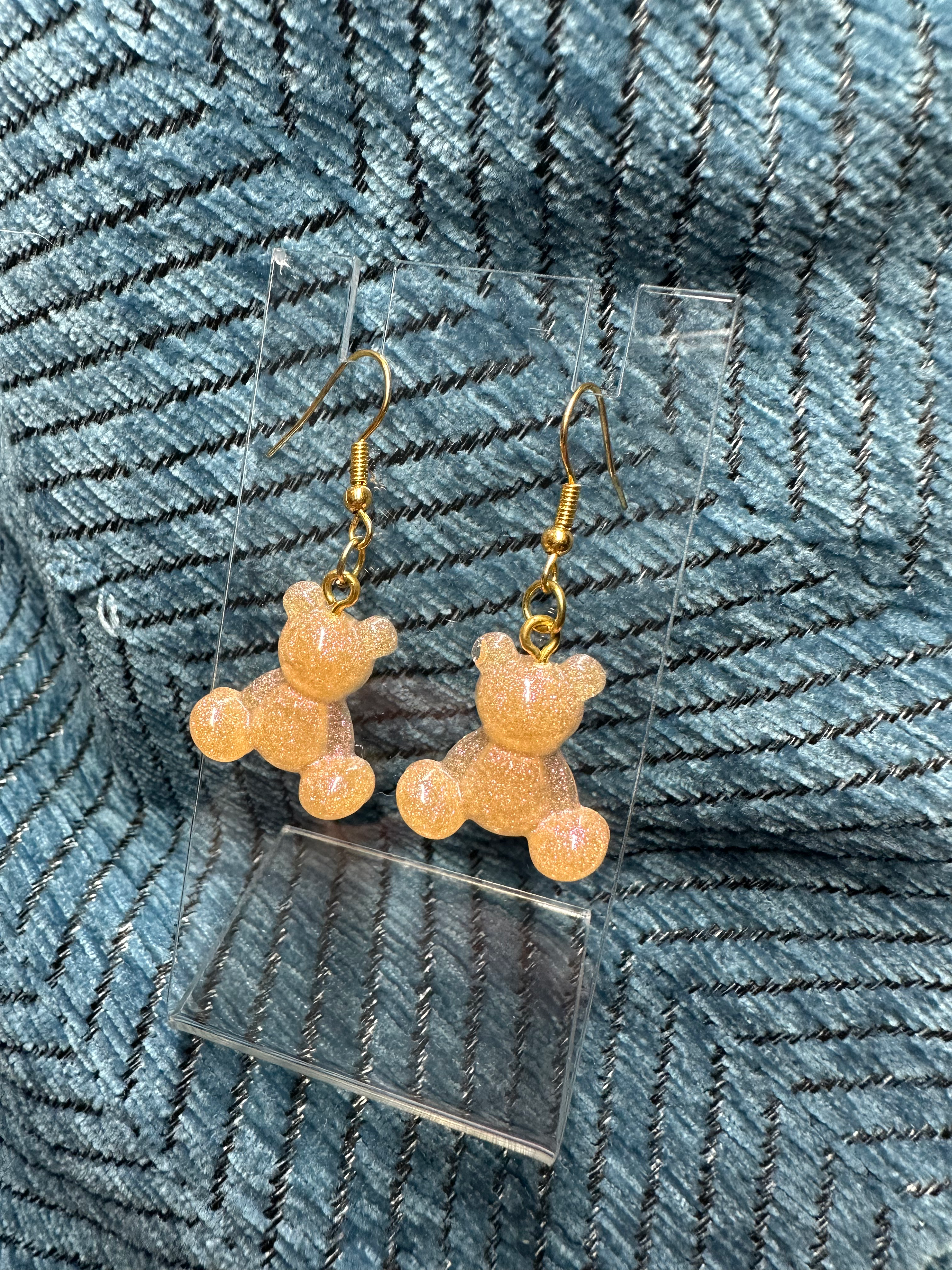Cute honey-gold glittery teddy bear earrings, perfect for whimsical everyday wear.