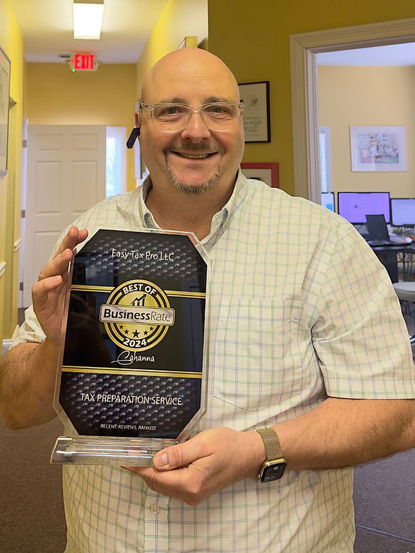 tim_holding_award.JPEG