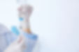 Female doctor with vial and syringe in h