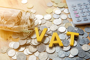 vat-concept-word-vat-put-coins-calculator-table_38391-66.jpg