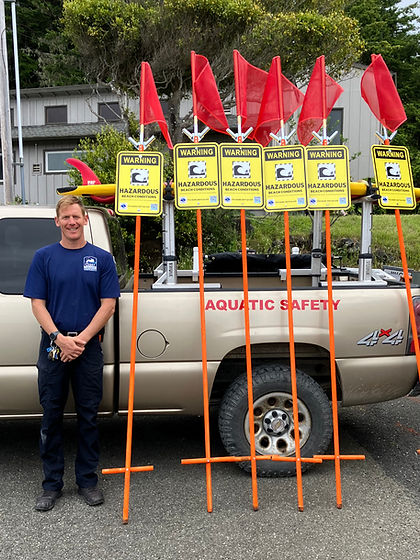 Luke Martinez with Ocean Hazard Signs