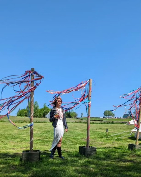 Bride with streamers on glamping hen weekend