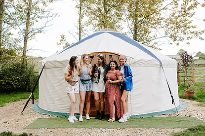 Women outside yurt on a hen weekend in Yorkshire
