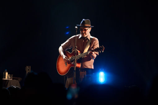 Matthew Goode performing on stage