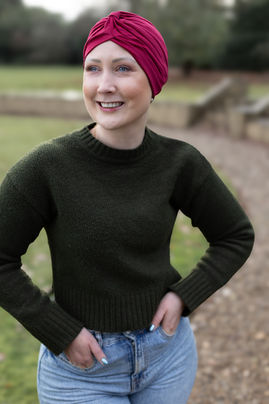 A young woman wearing a stylish bright turban