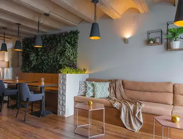 the dining room is decorated with plants and furniture