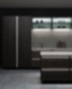 Atmospheric Poggenpohl kitchen featuring island with subtle LED lighting recessed in to the handle profile on the door fronts.