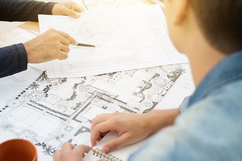 Architects (landscape designers) discussing blueprints.jpg