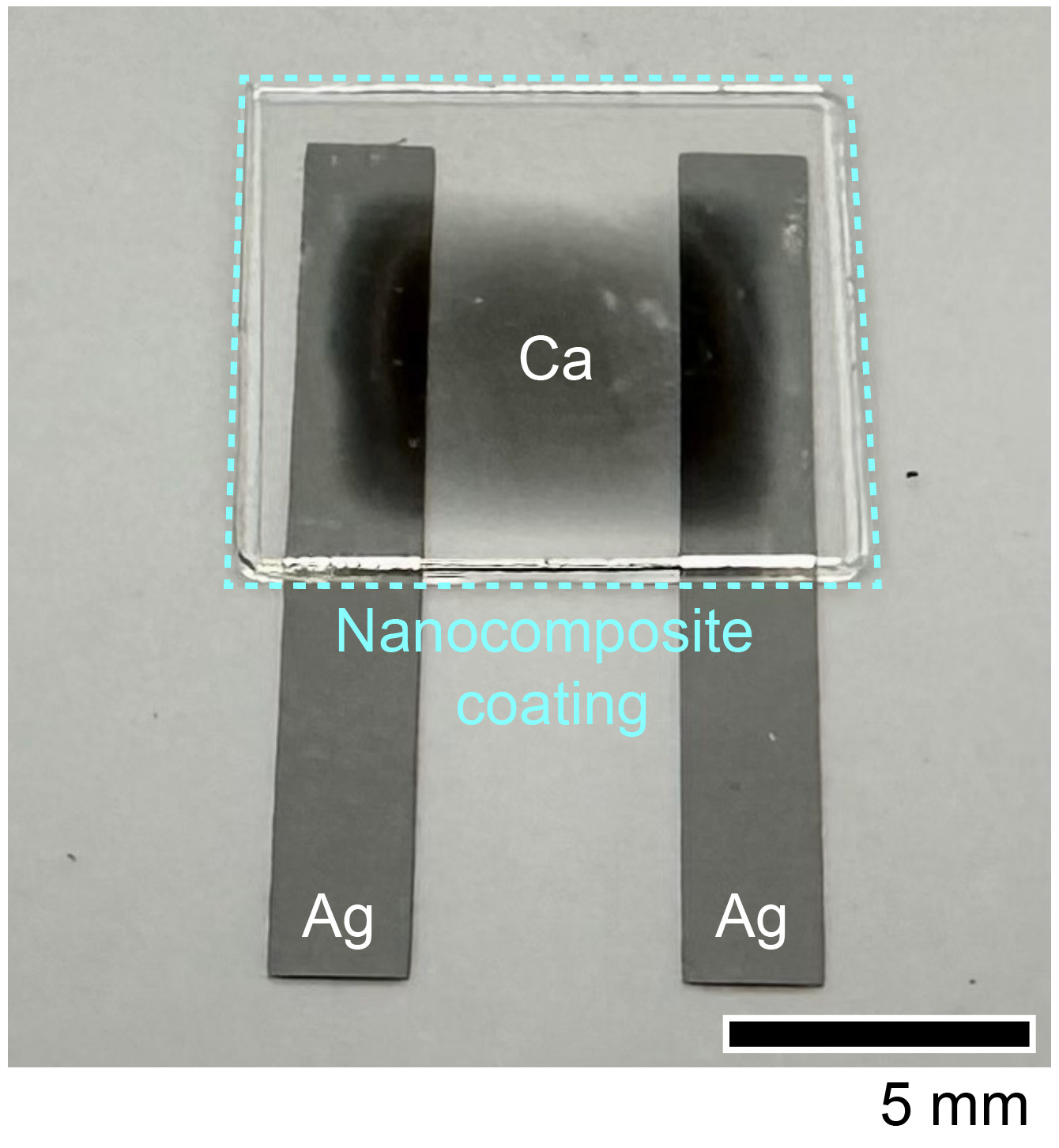 Microelectronic device fabricated in the Electrical Engineering and Computer Science Department at UC Berkeley. Electrical calcium tests demonstrated the self-assembling nanosheet’s potential as an oxygen barrier for microelectronics such as thin-film solar materials called organic photovoltaics. @ Jasmine Jan, UC Berkeley