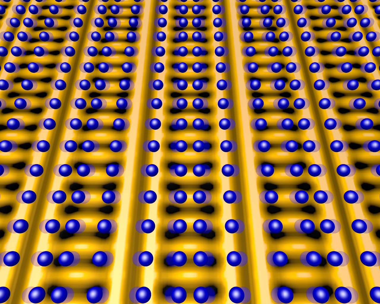 This image shows the positions of atoms (blue spheres) that make up the crystal lattice of a copper-oxide superconductor, superimposed on a map of electronic charge distribution (yellow is high charge density, dark spots are low) in charge-ordered states. Normally, the atoms can vibrate side-to-side (shadows represent average locations when vibrating). But when cooled to the point where the ladder-like charge density wave appears, the atomic positions shift along the "rungs" and the vibrations cease, locking the atoms in place. Understanding these charge-ordered states may help scientists unlock other interactions that trigger superconductivity at lower temperatures. @ Brookhaven National Laboratory