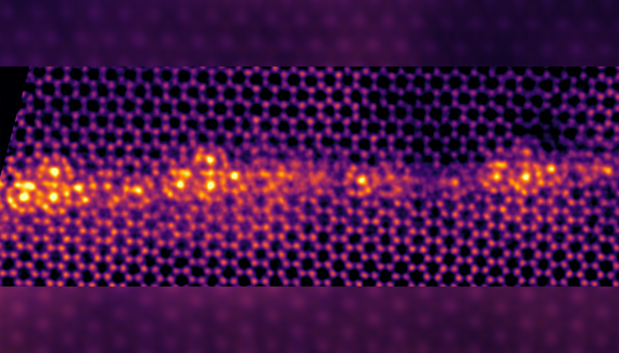 Using atomic-resolution scanning transmission electron microscopy, researchers found that in the presence of iron, the grain boundary of titanium undergoes a phase transition, forming “cages” or “clusters” at the grain boundary (the gold region at the center of the image). @ Tim Frolov/LLNL
