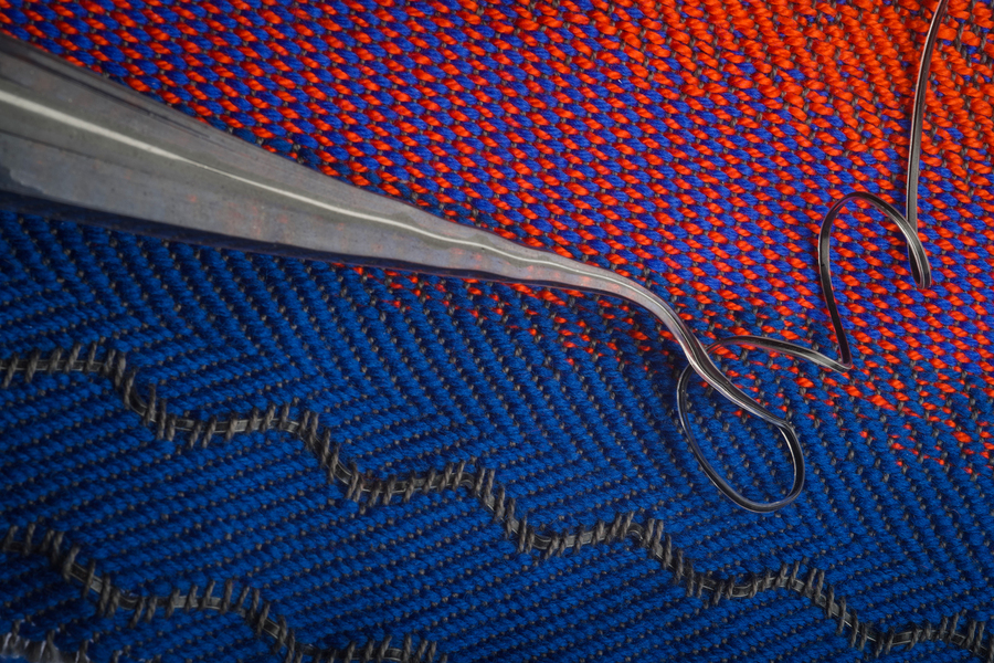 An MIT team has designed an “acoustic fabric,” woven with a fiber that is designed from a “piezoelectric” material that produces an electrical signal when bent or mechanically deformed, providing a means for the fabric to convert sound vibrations into electrical signals. @ Greg Hren