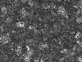 Scanning electron microscope (SEM) image of a chiral 2D metal halide perovskite material synthesized with acetonitrile. Chiral perovskite films made with acetonitrile respond strongly to circularly polarized light.