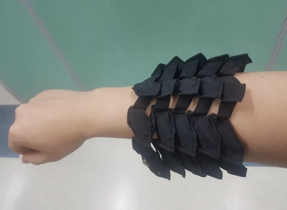 Flexible, stretchable battery developed by research team at KIMM shown on an individual’s arm and hand. @ Korea Institute of Machinery and Materials