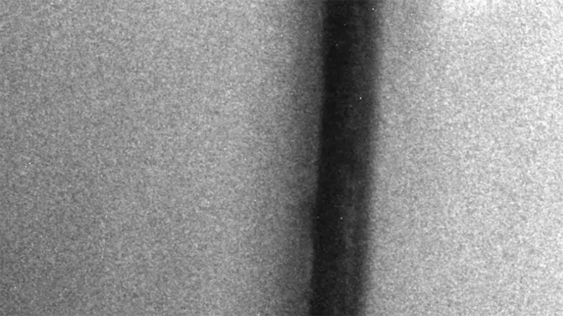 A steel particle is shown piercing through the nanofibrous hydrogel and exiting at a reduced velocity. The difference in velocity before and after gave the researchers a direct measurement of the material’s impact resistance, or the amount of energy it can absorb. @ Courtesy of the researchers