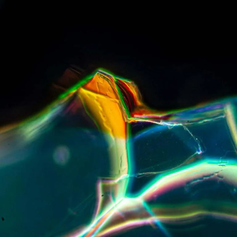 The ancient Roman glass seen up close. “While the age of the glass may be part of its charm, in this case if we could significantly accelerate the process in the laboratory, we might find a way to grow optical materials rather than manufacture them,” said Fiorenzo Omenetto. @ Giulia Guidetti