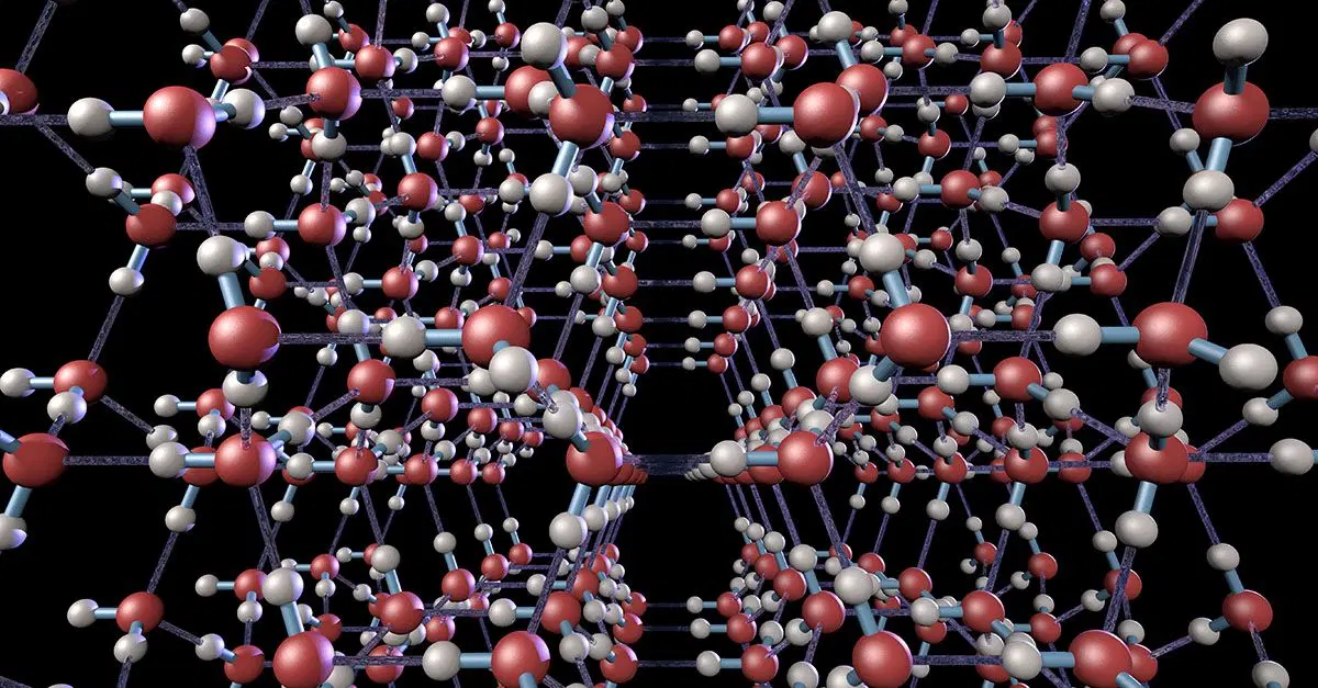 Ball-and-stick model of water molecules locked into a hexagonal structure by hydrogen bonds when water freezes into ice. @ iStock.